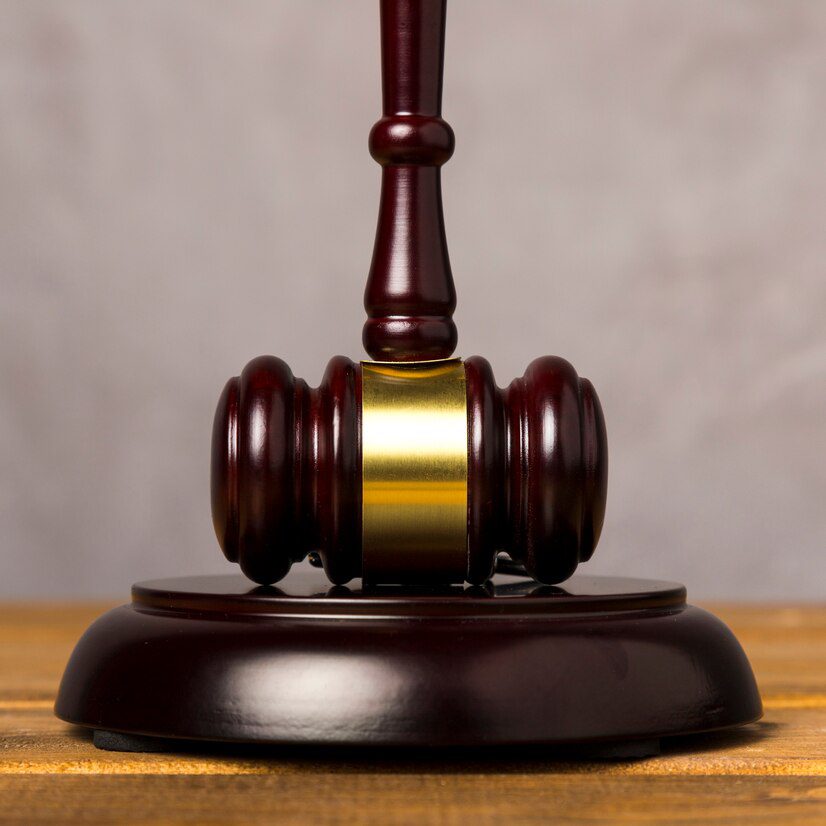 close up judge gavel with its striking block